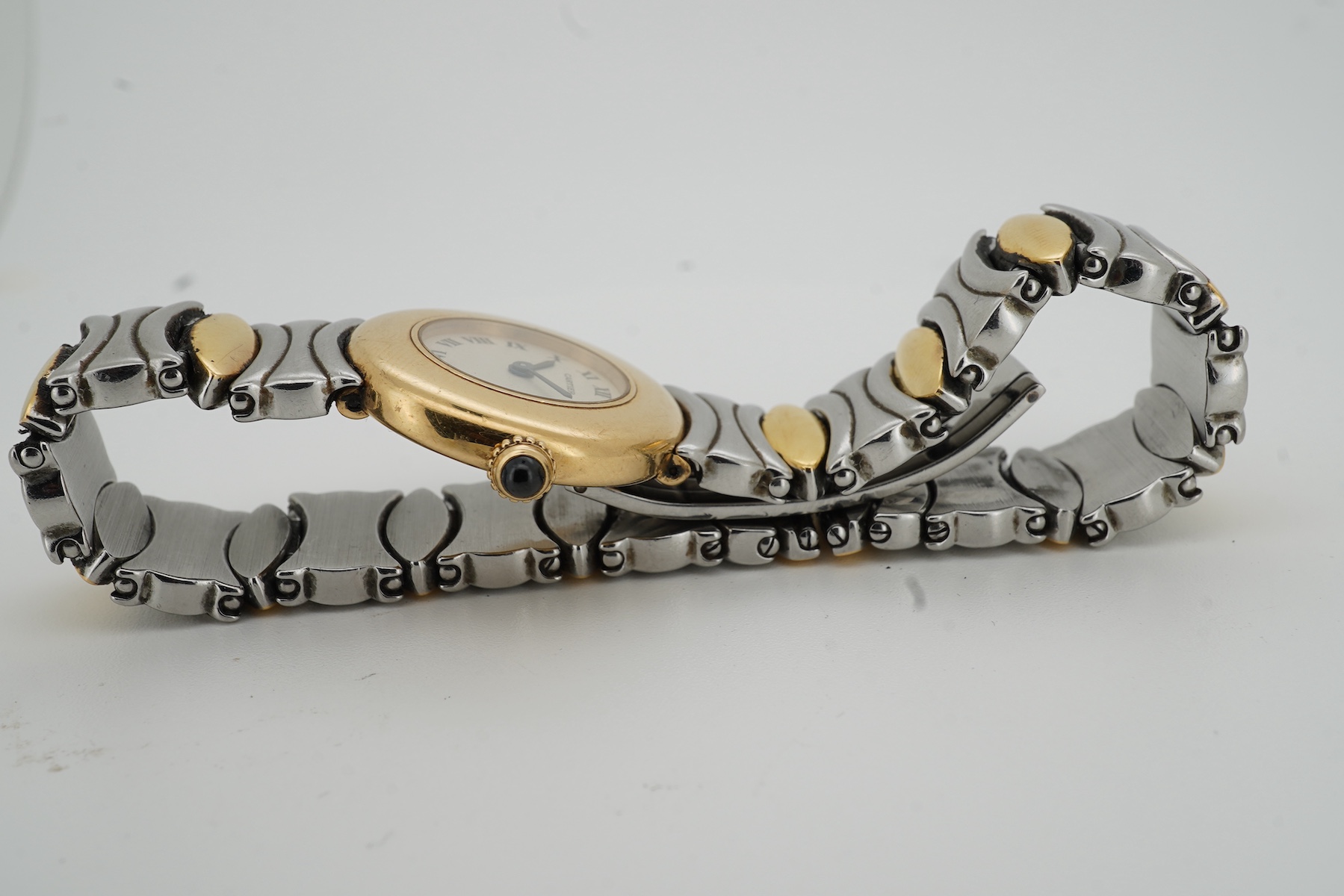 Cartier, a lady's gold and stainless steel wristwatch, 'Colisée', ref.8057908C